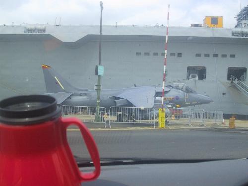 Sea Harrier in front of HMS Ark Royal