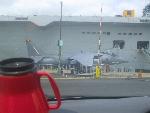 Sea Harrier in front of HMS Ark Royal
